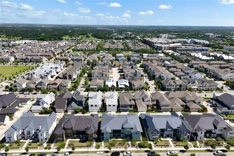 an aerial view of residential building with parking