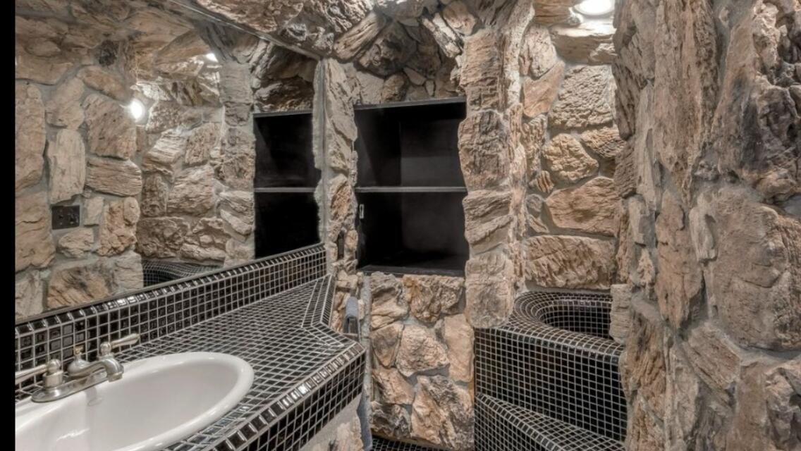 2911 Holly Road Santa Barbara, CA 93105 - Photo 14 of 20 a bathroom with a sink and a mirror