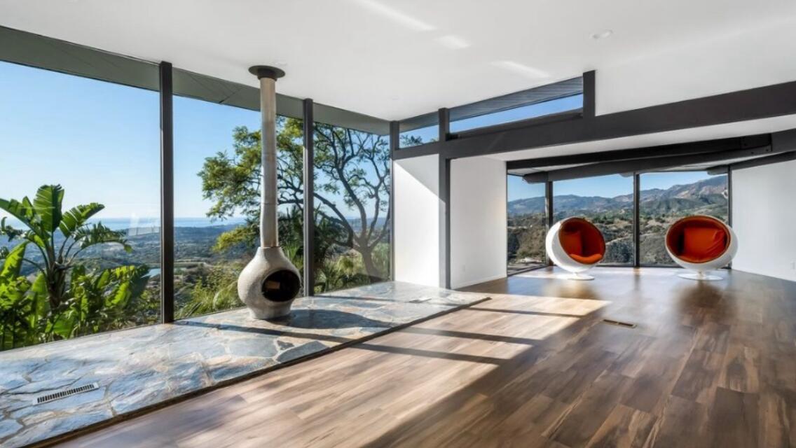 2911 Holly Road Santa Barbara, CA 93105 - Photo 6 of 20 a living room with a wooden floor and potted plant