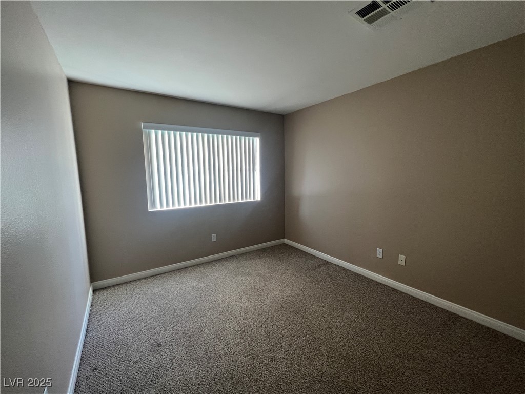 8600 West Charleston Boulevard, Unit 1060 Las Vegas, NV 89117 - Photo 10 of 14 Carpeted spare room with baseboards