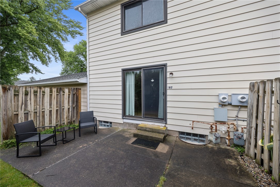 597 French Road Brighton, NY 14618 - Photo 21 of 24 Back yard patio accessible from the living area.