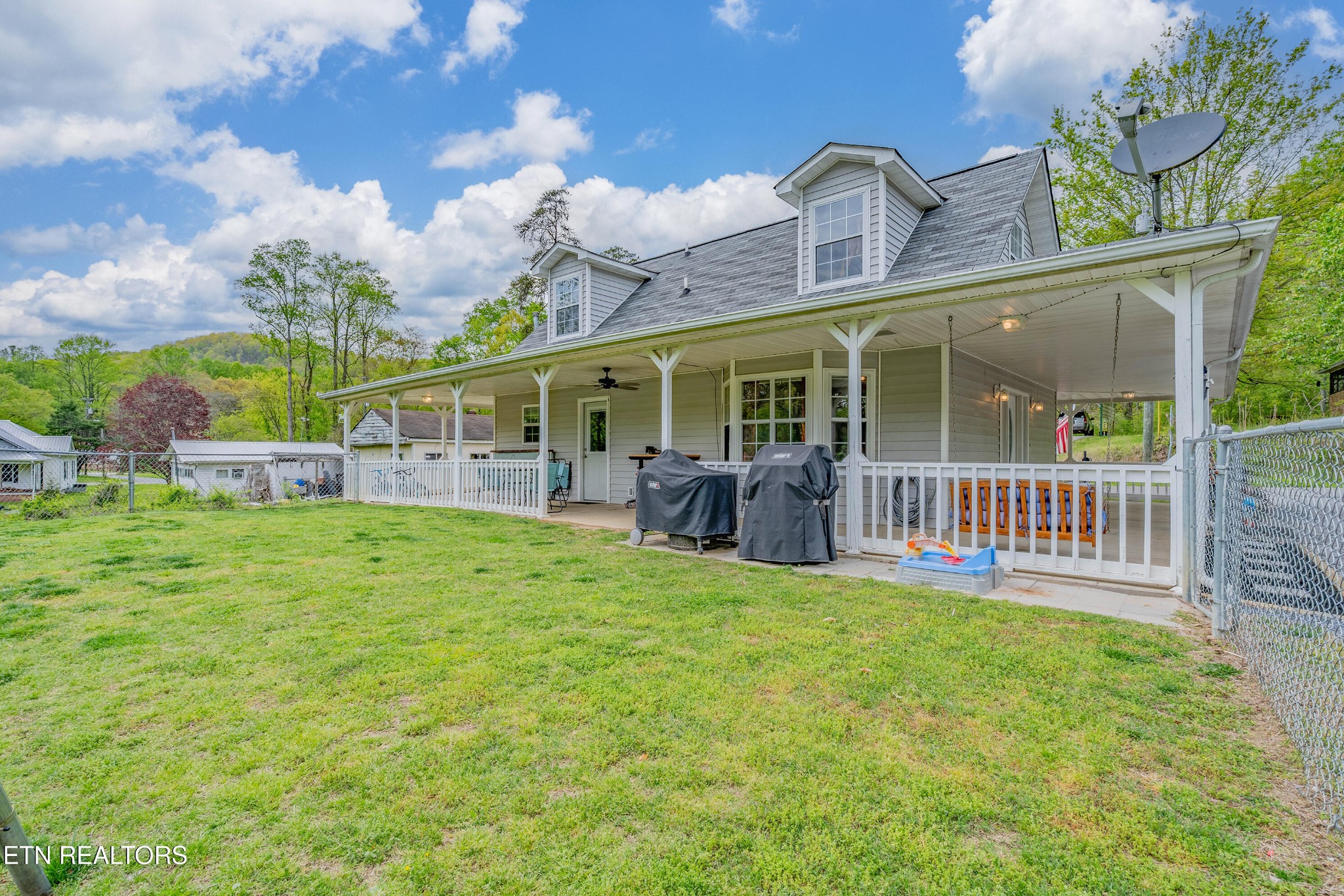 632 Butler Mill Road Oliver Springs, TN 37840 - Photo 29 of 34 a view of a house with a backyard and porch