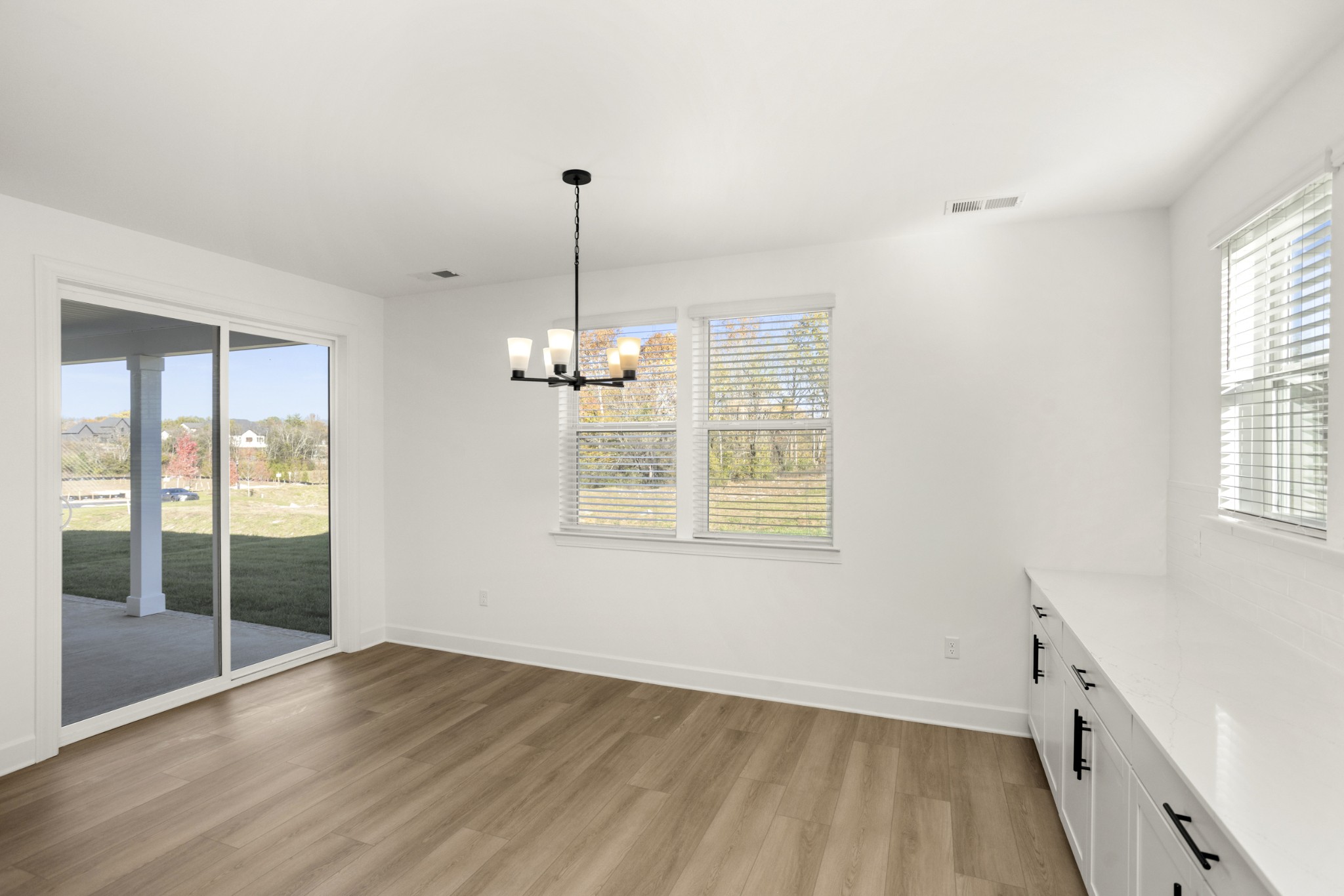 205 Acmon Blue Road Mount Juliet, TN 37122 - Photo 22 of 64 a view of empty room with wooden floor and fan