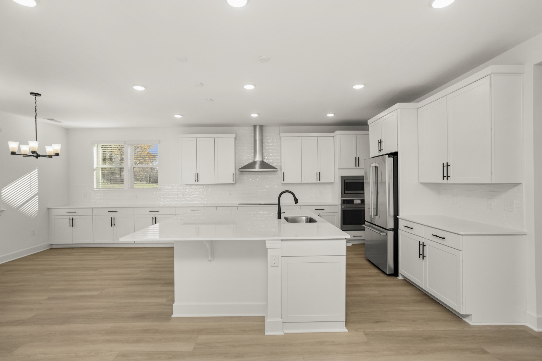 205 Acmon Blue Road Mount Juliet, TN 37122 - Photo 23 of 64 a kitchen with stainless steel appliances granite countertop a refrigerator sink and white cabinets