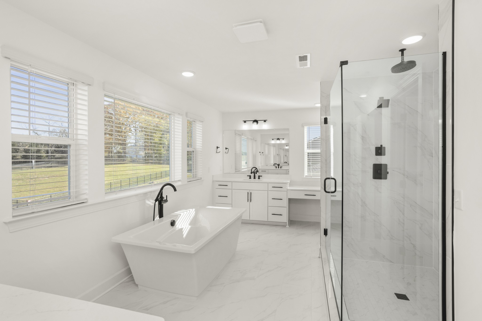 205 Acmon Blue Road Mount Juliet, TN 37122 - Photo 37 of 64 a bathroom with a bathtub shower sink and mirror