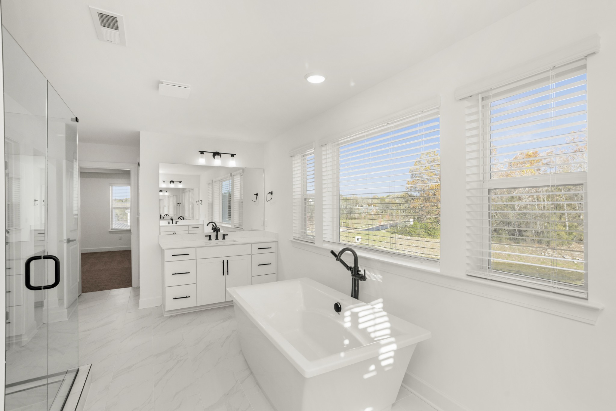 205 Acmon Blue Road Mount Juliet, TN 37122 - Photo 38 of 64 a spacious bathroom with a tub sink double vanity and shower