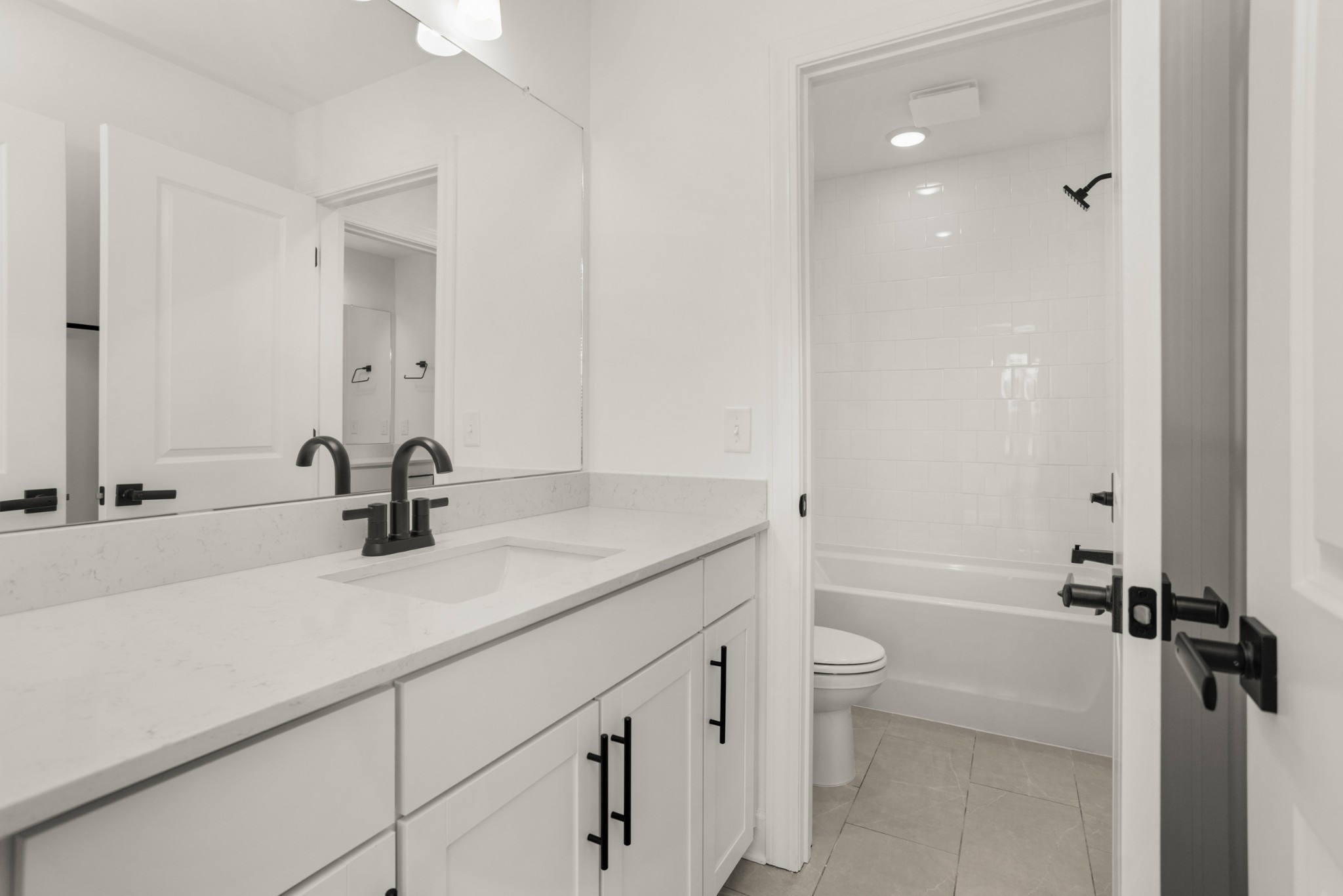 205 Acmon Blue Road Mount Juliet, TN 37122 - Photo 42 of 64 a bathroom with a sink a toilet and a large mirror