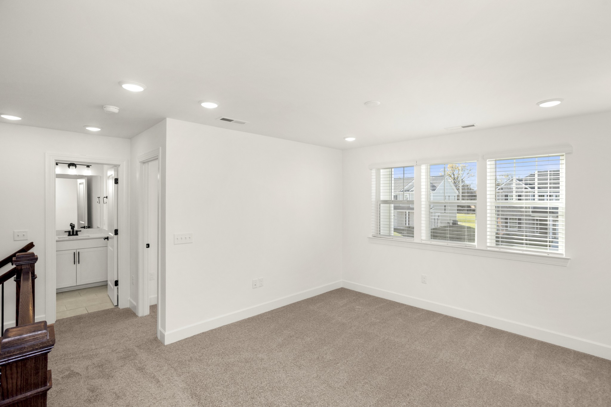 205 Acmon Blue Road Mount Juliet, TN 37122 - Photo 45 of 64 an empty room with a cabinet and mirrors