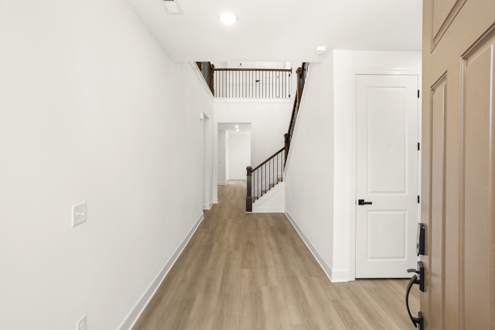 205 Acmon Blue Road Mount Juliet, TN 37122 - Photo 5 of 64 a view of a hallway with wooden floor and staircase