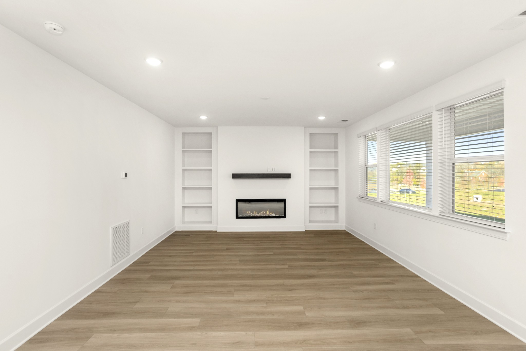 205 Acmon Blue Road Mount Juliet, TN 37122 - Photo 10 of 64 a view of an empty room with a window and fireplace