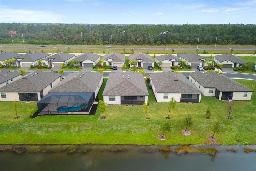 19729 Fishhawk Trail Venice, FL 34293 - Photo 40 of 45 an aerial view of a house with big yard and large tree