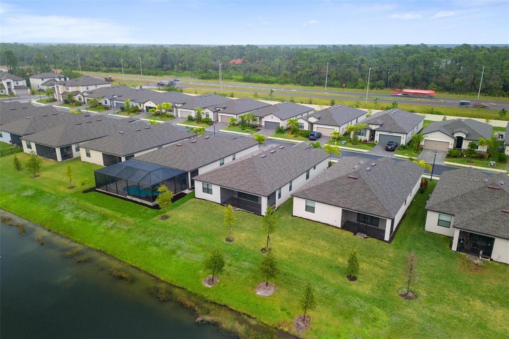 19729 Fishhawk Trail Venice, FL 34293 - Photo 41 of 45 an aerial view of multiple houses with yard