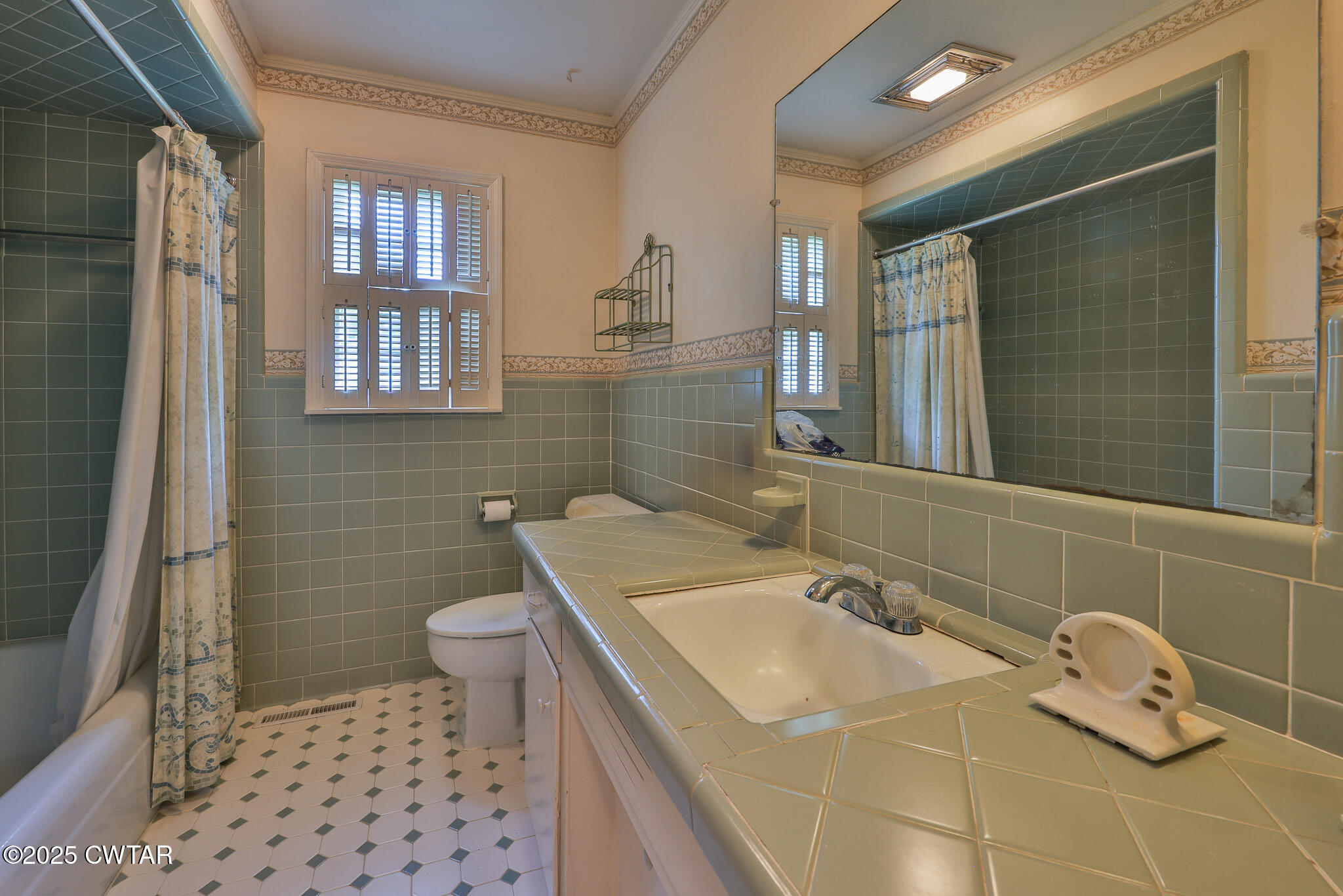 103 West Main Street Greenfield, TN 38230 - Photo 15 of 25 a bathroom with a sink toilet and shower