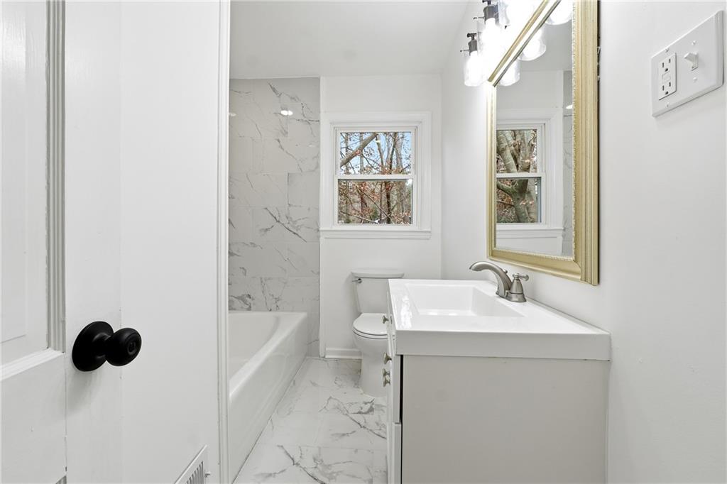2520 Overlook Way Northeast Atlanta, GA 30345 - Photo 19 of 31 a bathroom with a sink a toilet and shower