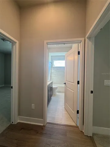 an empty room with an entryway door
