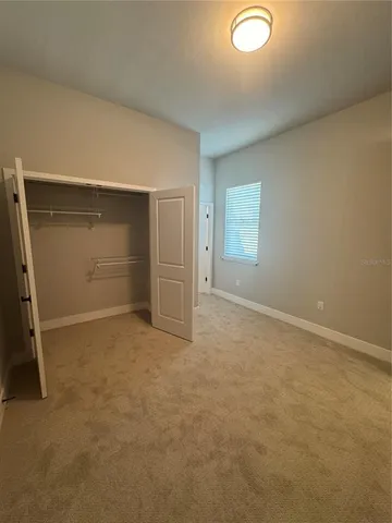 a bathroom with a toilet and a bath tub