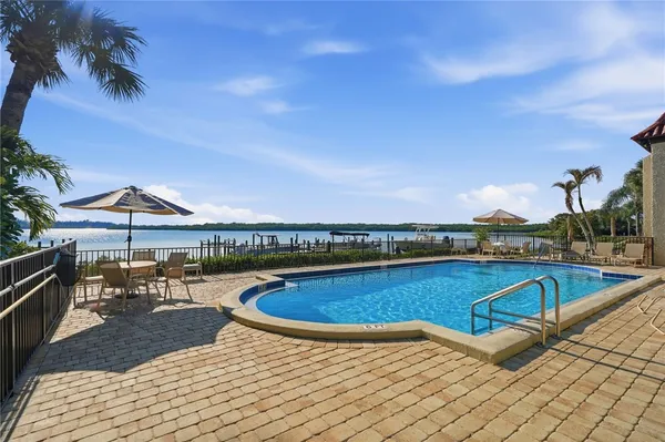 a view of a swimming pool with lounge chair