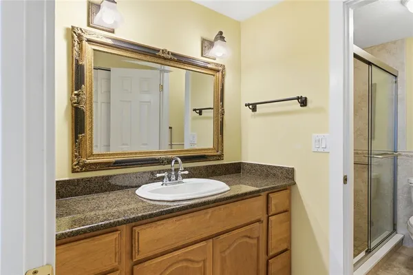 a bathroom with a sink and a mirror