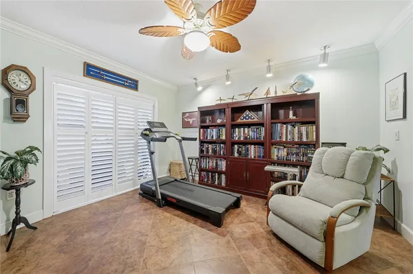 a living room with furniture a air conditioner and a window