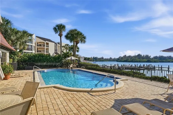 a view of swimming pool with a patio