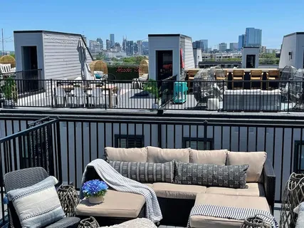 a view of a balcony with furniture