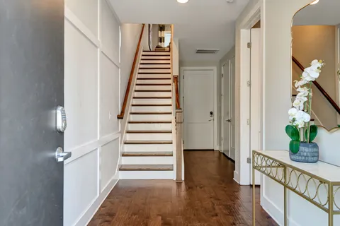 a view of entryway with wooden floor