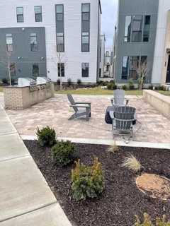 a view of a building with garden and sitting area