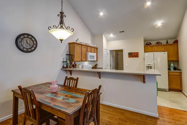a view of kitchen and dining area with furniture