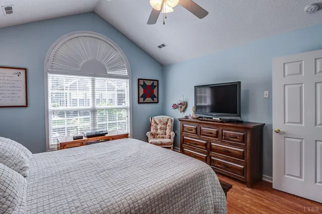 a dining room with furniture and a chandelier
