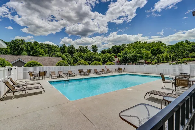 a view of a garden with flowers and trees