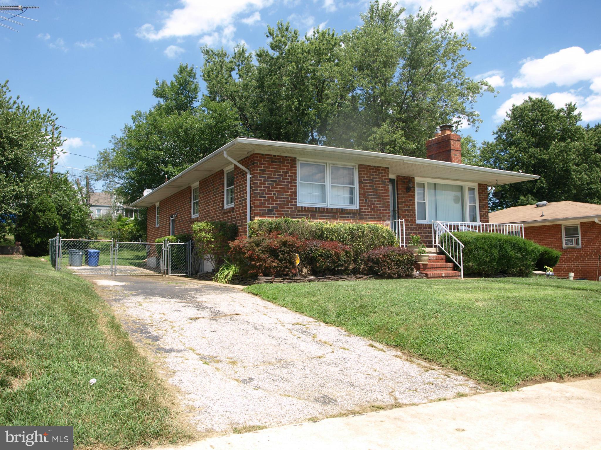 1211 Gettig Road Baltimore, MD 21237 - Photo 23 of 30 a front view of a house with a yard