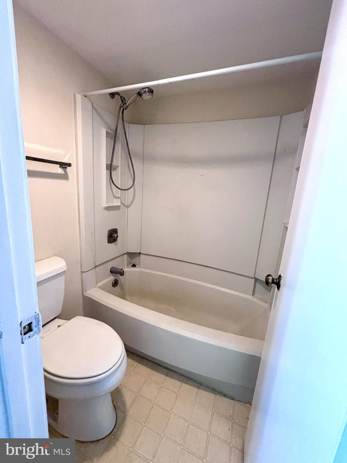 5901 Mt Eagle Drive, Unit 1009 Alexandria, VA 22303 - Photo 9 of 17 a bathroom with a toilet and a shower