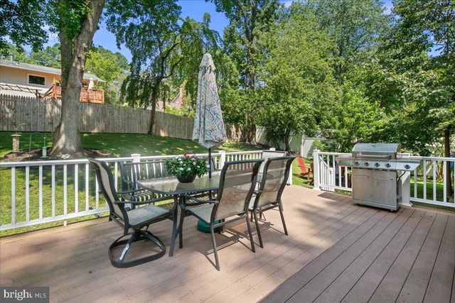 a view of backyard with a table and chairs