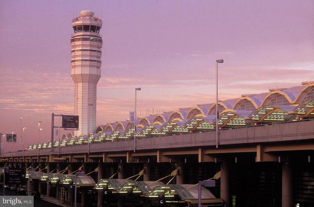 a view of a city with tall buildings and ocean view