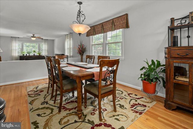 a view of a dining room with furniture and a window