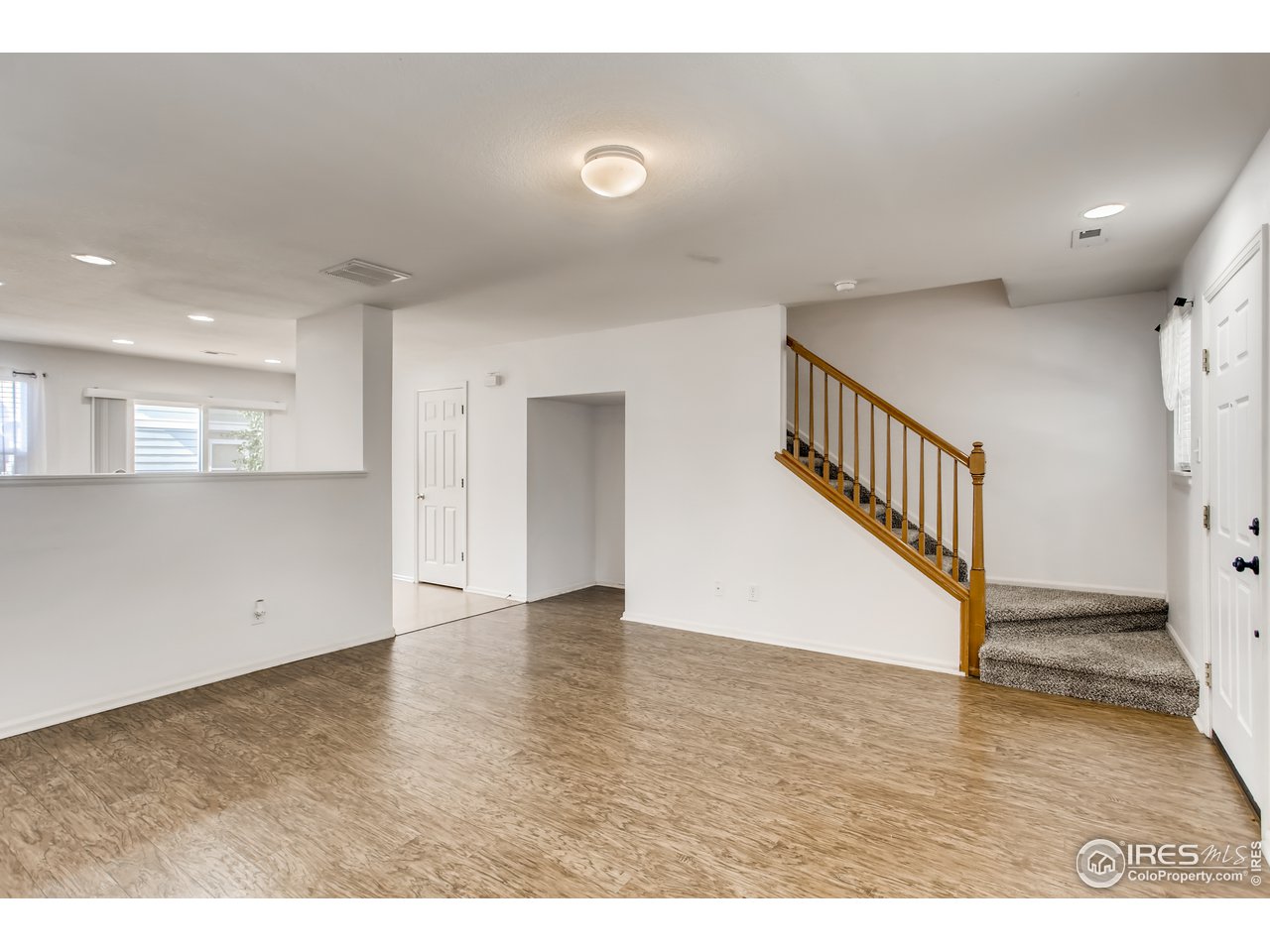 10439 Lower Ridge Road Longmont, CO 80504 - Photo 5 of 27 Living room looking towards stairs
