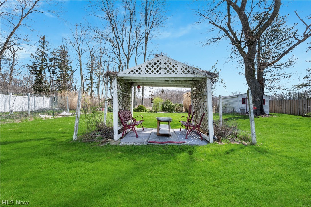 6597 York Road Parma Heights, OH 44130 - Photo 32 of 34 View of shed / structure featuring a lawn and a gazebo