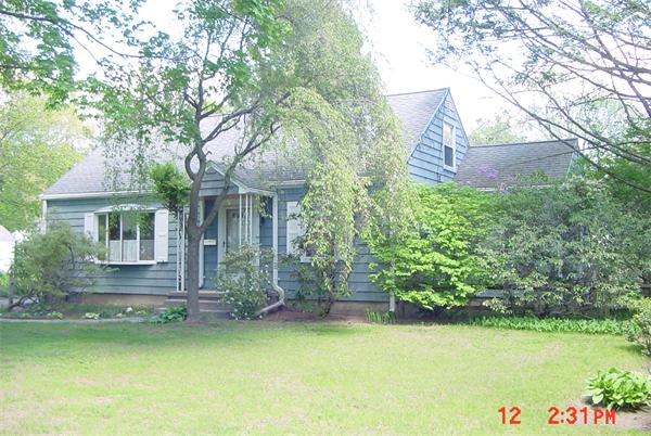 139 Mayflower Road Springfield, MA 01118 - Photo 1 of 1 a front view of a house with a garden and lake view