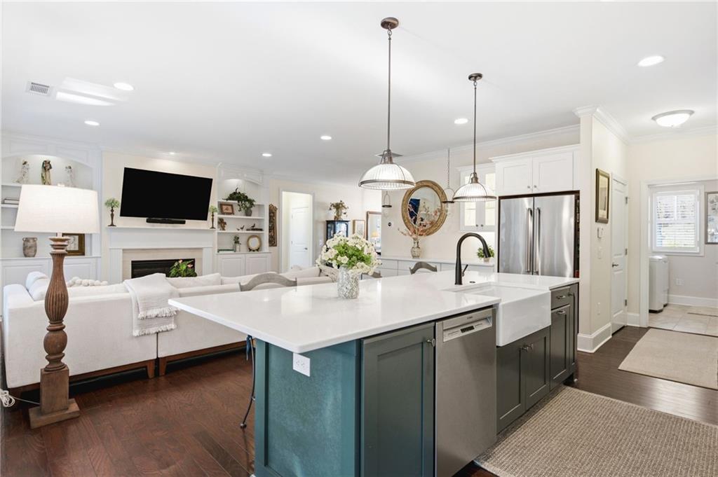 91 Bellwind Lane Dallas, GA 30132 - Photo 15 of 44 a living room with furniture a fireplace and a flat screen tv