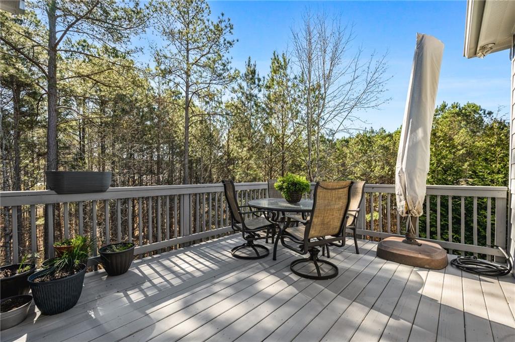 91 Bellwind Lane Dallas, GA 30132 - Photo 19 of 44 a view of balcony with wooden floor and outdoor seating