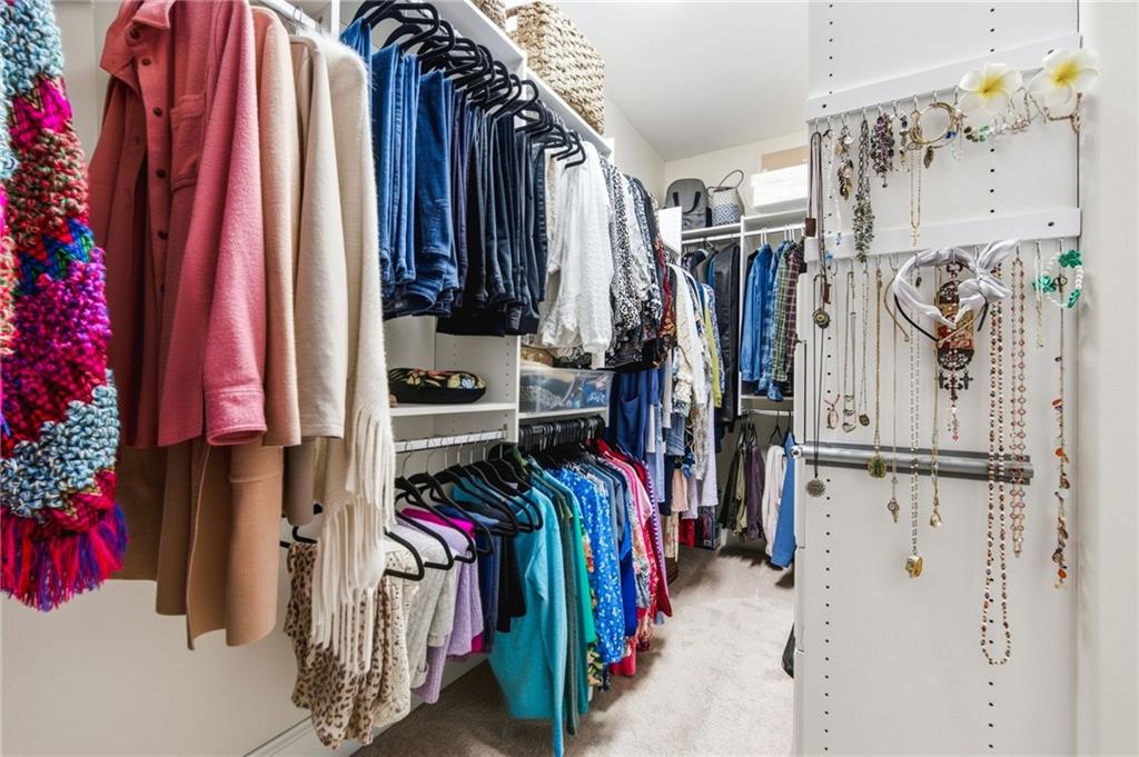 91 Bellwind Lane Dallas, GA 30132 - Photo 26 of 44 a view of walk in closet with clothes