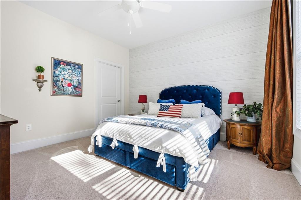 91 Bellwind Lane Dallas, GA 30132 - Photo 28 of 44 a bed sitting in a bedroom next to a window