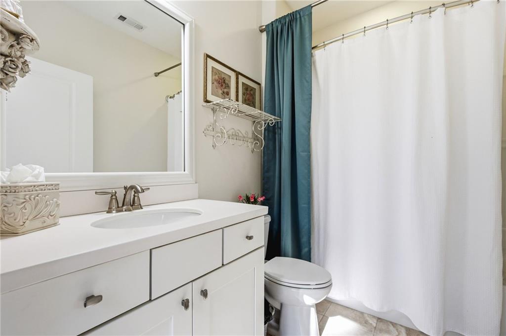 91 Bellwind Lane Dallas, GA 30132 - Photo 29 of 44 a bathroom with a sink and a toilet