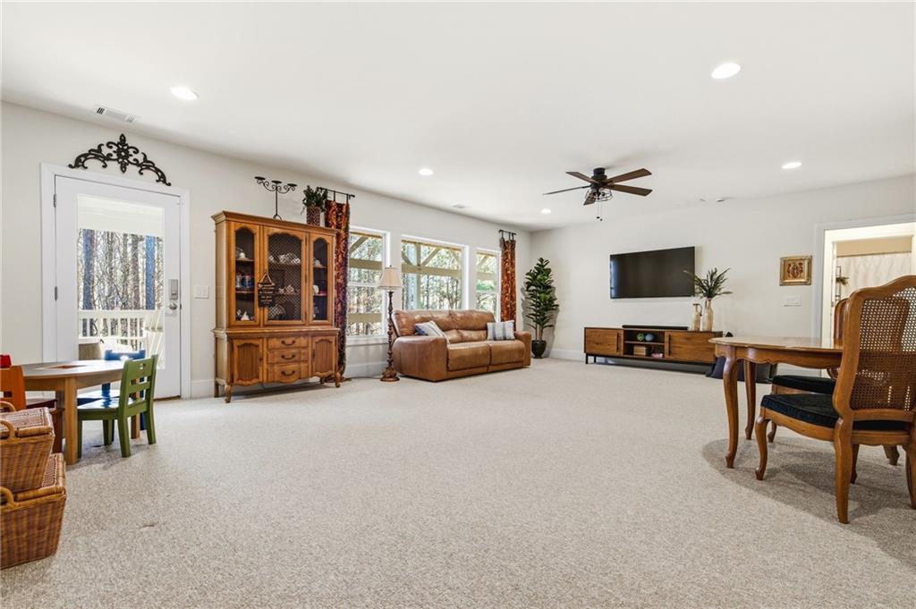 91 Bellwind Lane Dallas, GA 30132 - Photo 30 of 44 a living room with furniture and a flat screen tv
