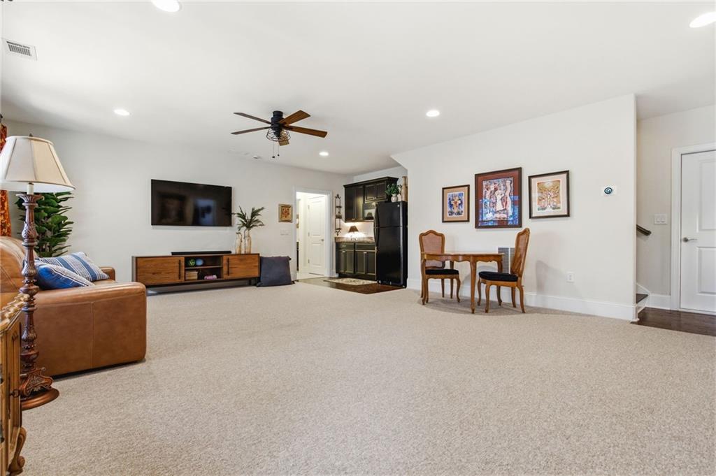 91 Bellwind Lane Dallas, GA 30132 - Photo 31 of 44 a living room with furniture and a flat screen tv