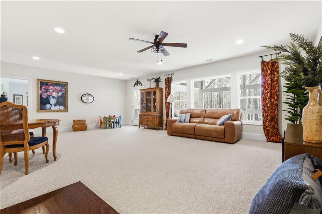 91 Bellwind Lane Dallas, GA 30132 - Photo 33 of 44 a living room with furniture and a large window