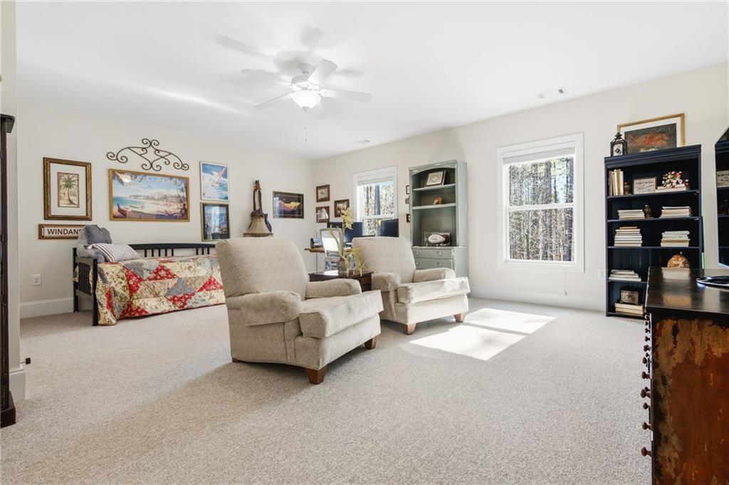 91 Bellwind Lane Dallas, GA 30132 - Photo 36 of 44 a living room with furniture and a flat screen tv