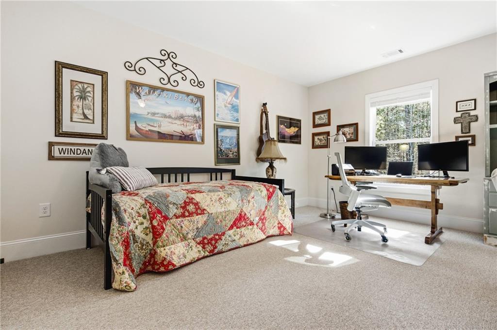 91 Bellwind Lane Dallas, GA 30132 - Photo 37 of 44 a bedroom with furniture and a flat screen tv