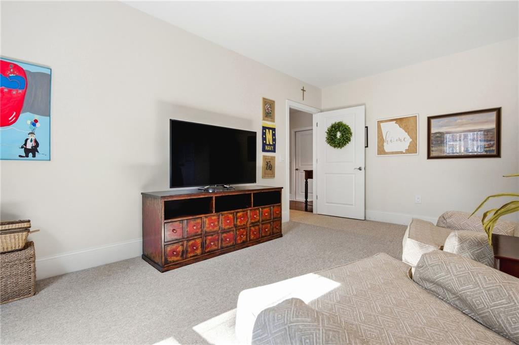 91 Bellwind Lane Dallas, GA 30132 - Photo 38 of 44 a living room with furniture and a flat screen tv