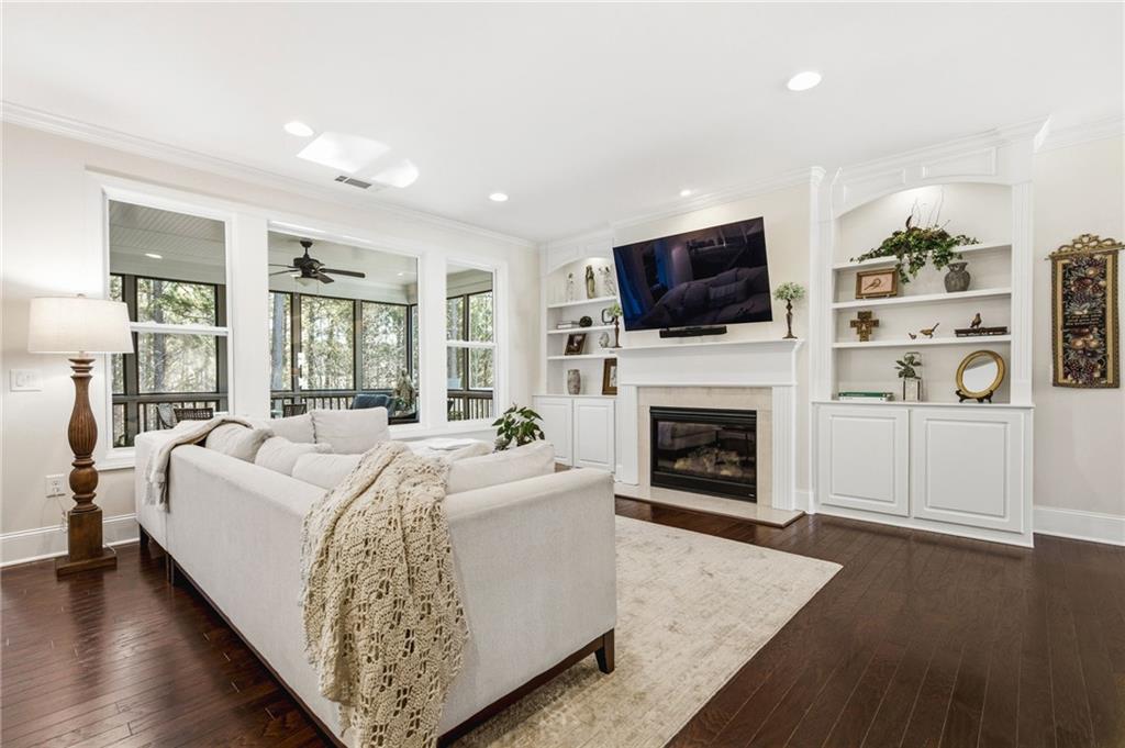 91 Bellwind Lane Dallas, GA 30132 - Photo 7 of 44 a living room with furniture a flat screen tv and a fireplace